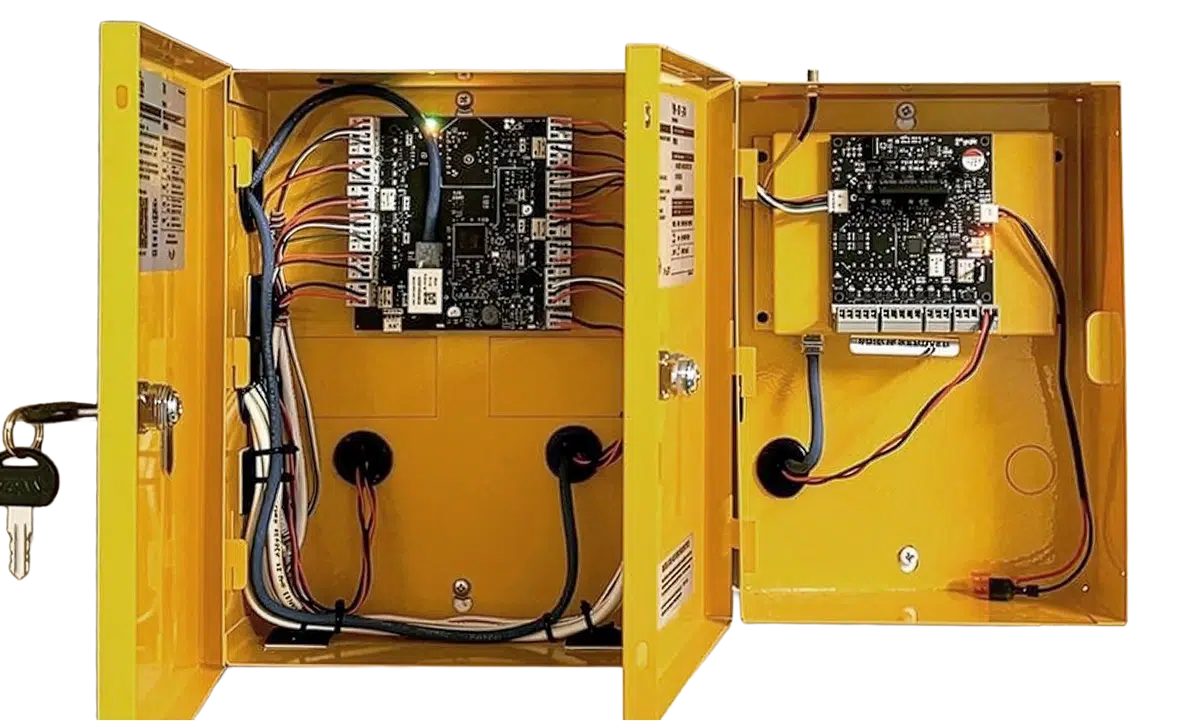State Fire technician installing a commercial security access control controller for integrated building security and access management systems.